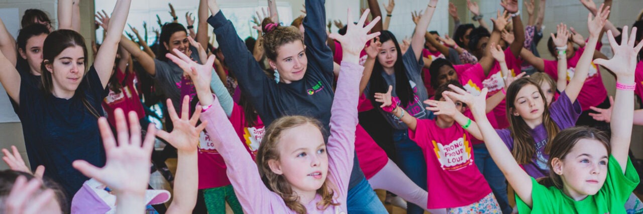 young woman and girls dancing